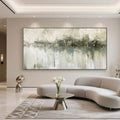 Modern living room with 'Still Waters' wabi-sabi abstract art above a curved sofa.