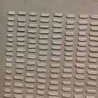 Close-up of raised grid textures on Wabi-Sabi painting.