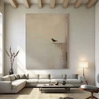 Zen minimalist hand-painted wall art with lone bird silhouette on neutral canvas in modern living room
