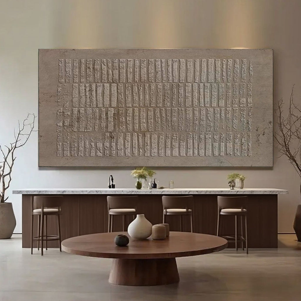 Wabi Sabi brown textured wall art above a bar area in a modern interior.