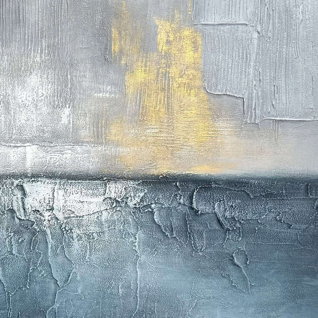 Close-up of blue gray abstract seascape art with raised texture and gold accents