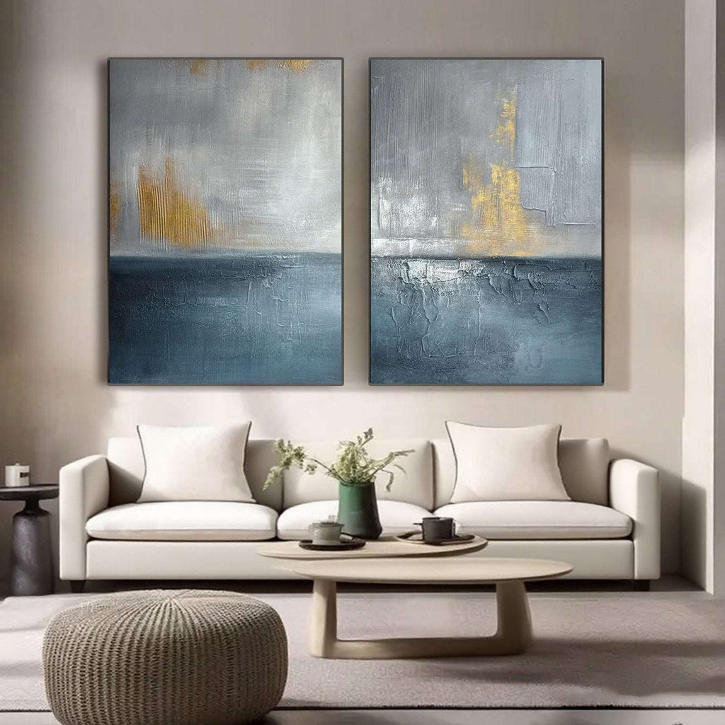 Gilded Storm blue gold abstract seascape wall art above a sofa