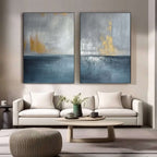 Gilded Storm blue gold abstract seascape wall art above a sofa