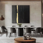 Abstract minimalist square canvas art featuring textured black panels with central gold vertical stripe, Auric Rift, in contemporary dining room.