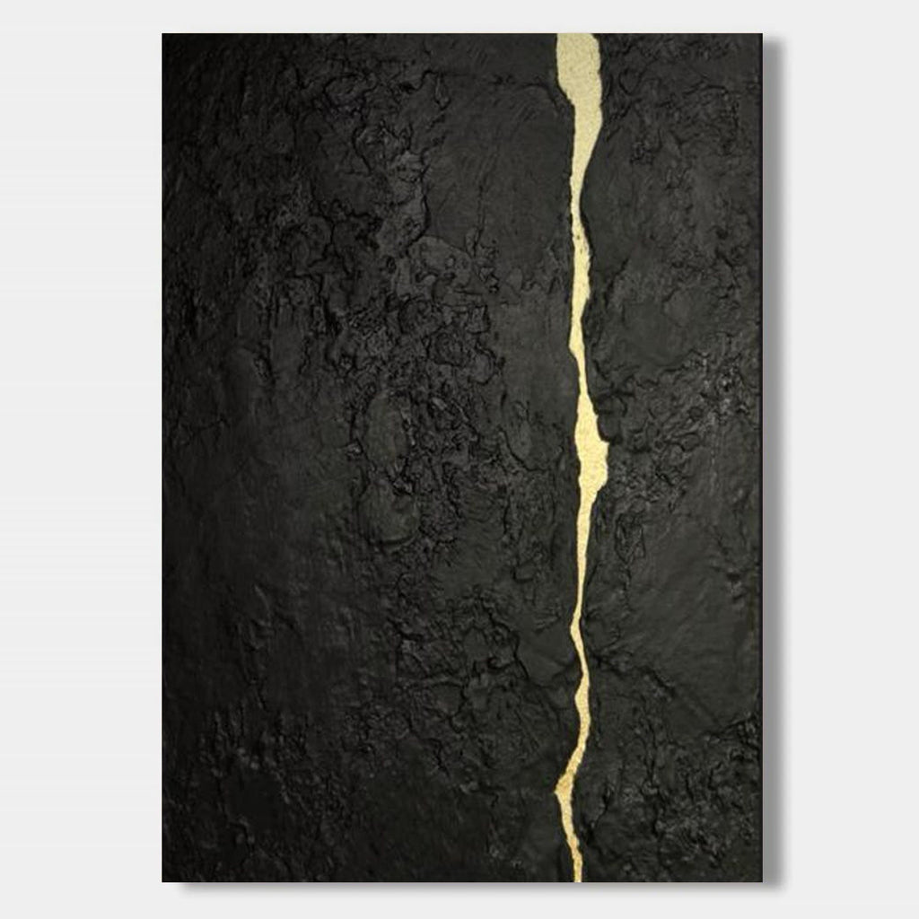 Abstract minimalist black textured canvas featuring a flowing gold kintsugi vein, hand-painted wall art for contemporary interiors.