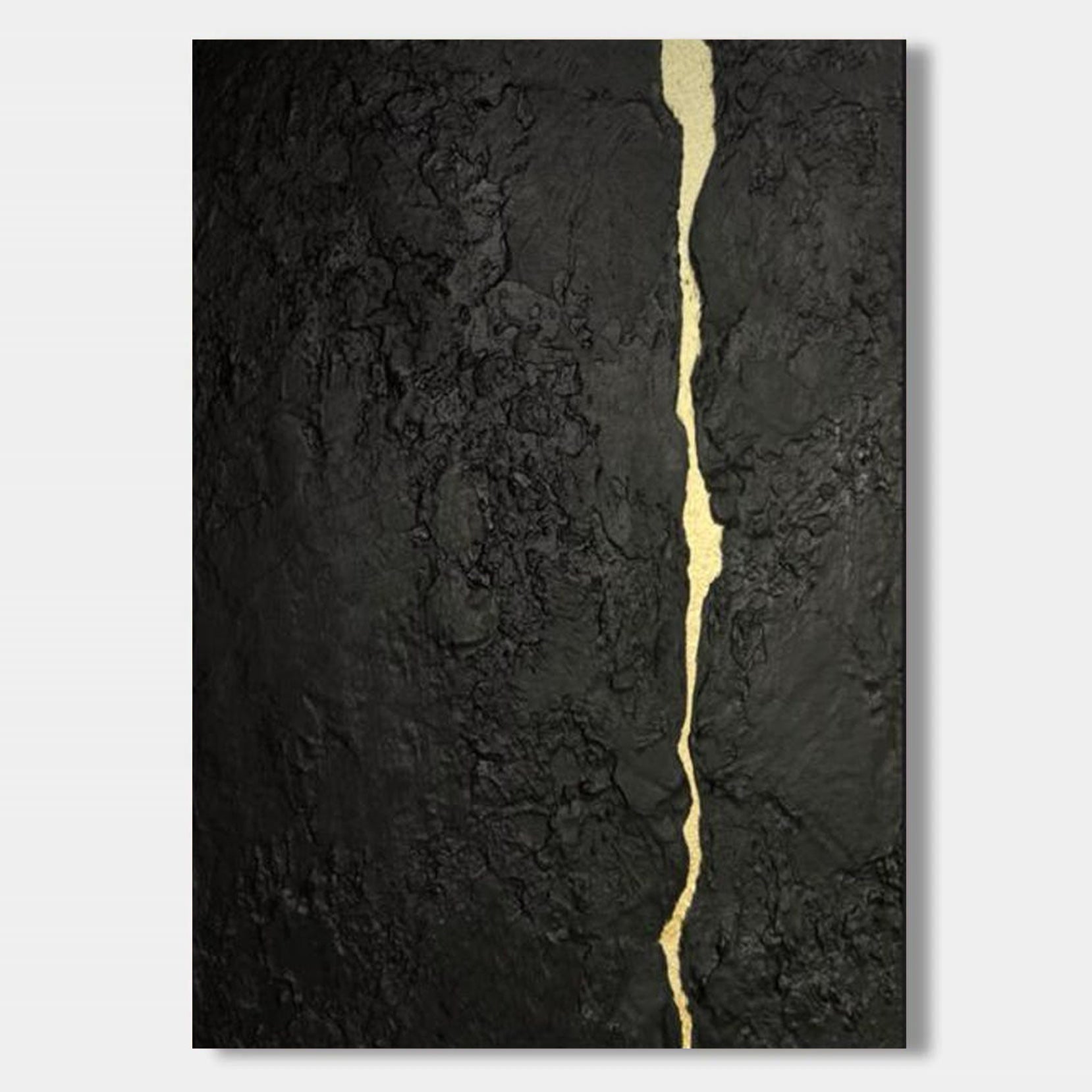 Abstract minimalist black textured canvas featuring a flowing gold kintsugi vein, hand-painted wall art for contemporary interiors.