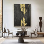 Minimalist black gold abstract painting 'Molten Vein' on canvas in contemporary space
