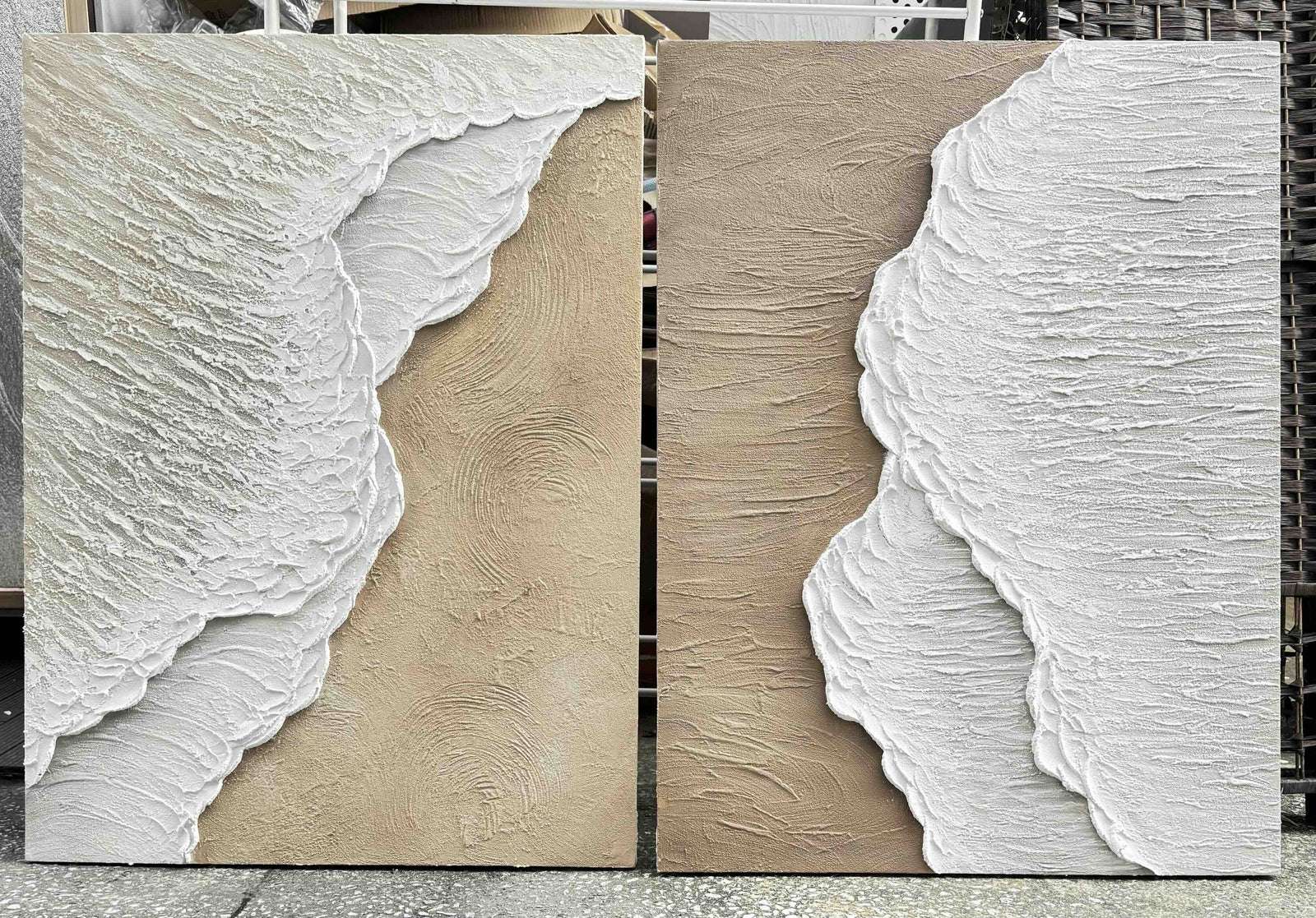 Close-up of beige coastal wall art with raised white foam texture across two panels