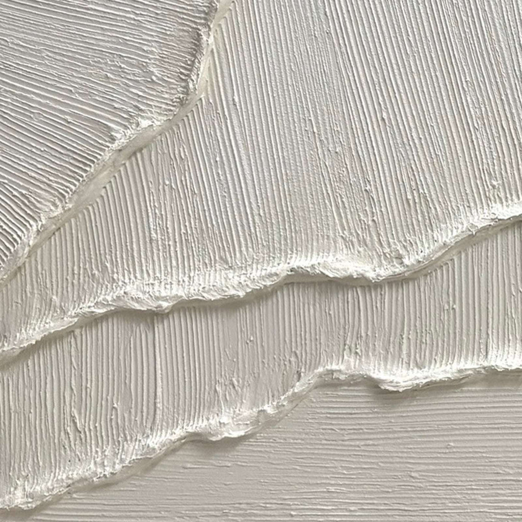 Detail of minimalist white 3D wall art with fine linear texture and raised relief
