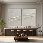 White 3D textured abstract wall art set displayed above a dining area