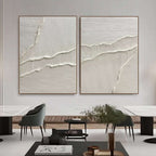 Minimalist white diptych with raised wave-like relief in a contemporary room