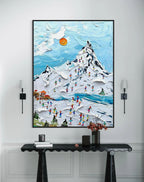 Textured wall art of a snowy ski resort scene with vibrant skiers, a snowy mountain, and a blue sky.
