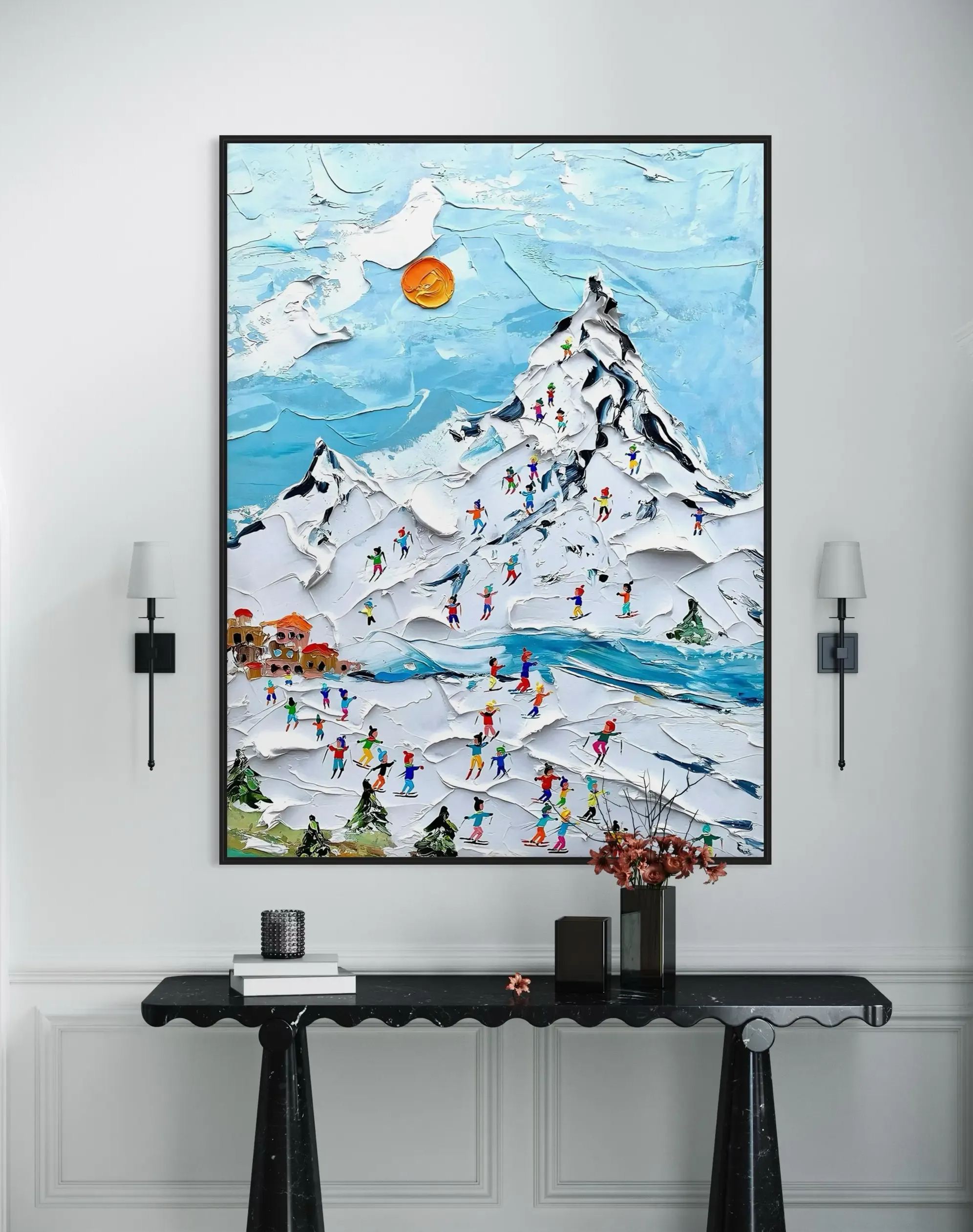 Textured wall art of a snowy ski resort scene with vibrant skiers, a snowy mountain, and a blue sky.