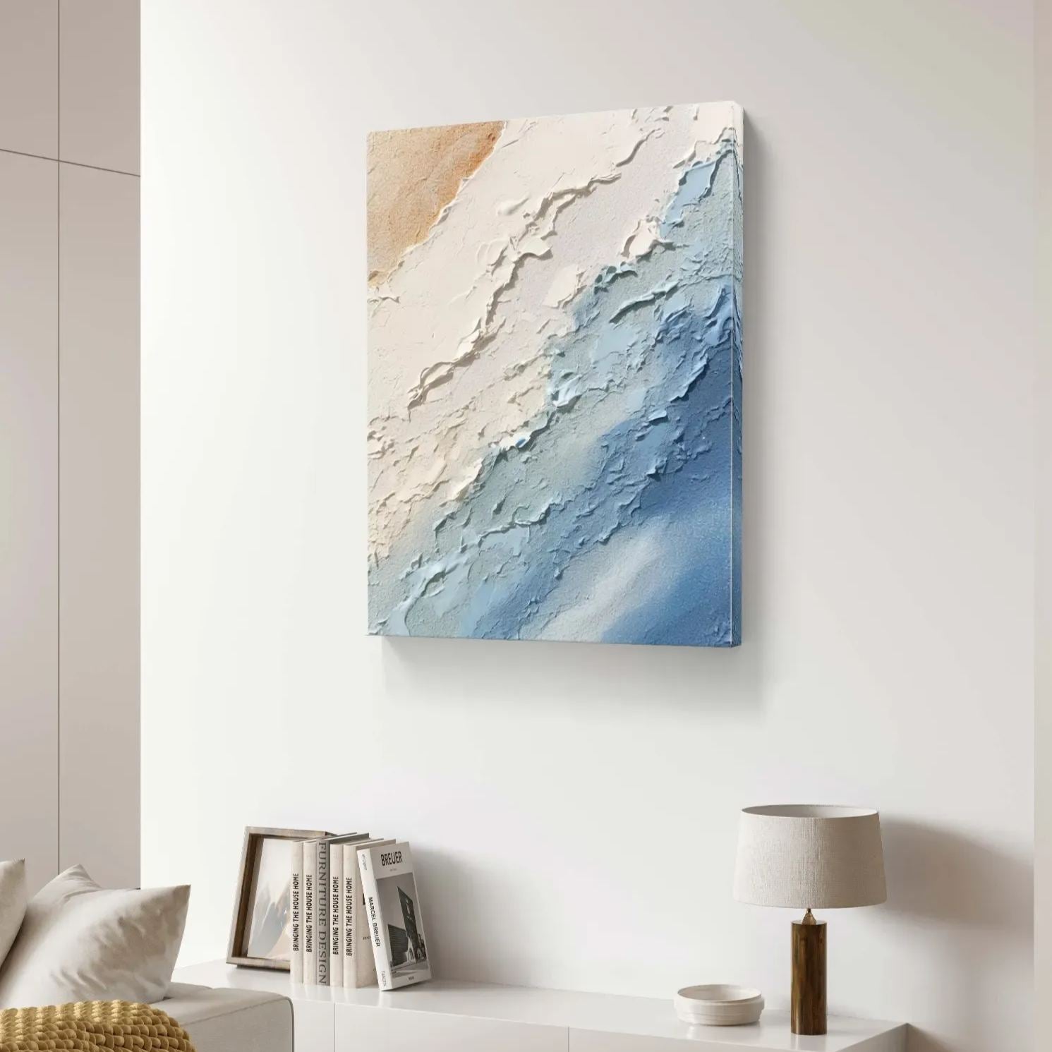 Modern abstract ocean painting above a white dresser
