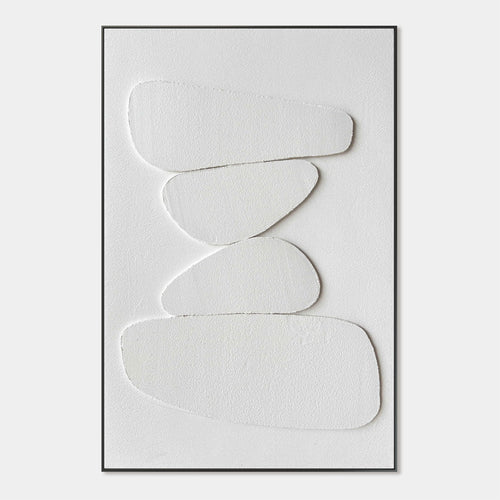 Wabi Sabi 3D textured minimalist wall art with stacked pale rounded shapes in soft white, framed in black, perfect for contemporary living rooms or bedrooms.