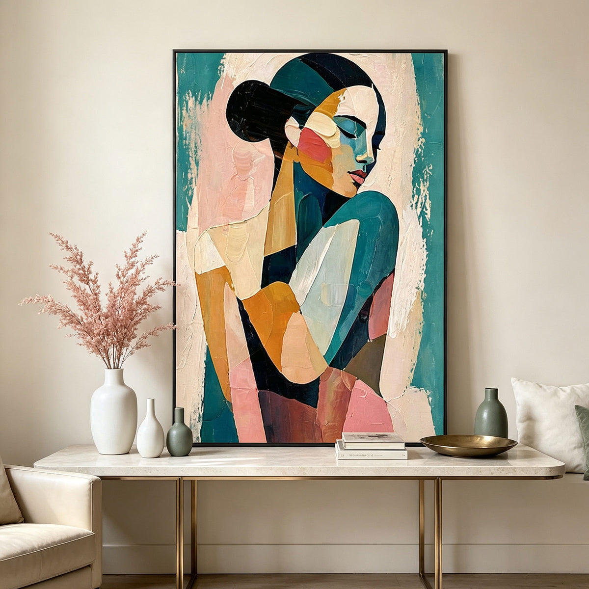 Abstract teal portrait canvas wall art with pink, cream and gold tones in a black frame displayed above a modern console table.